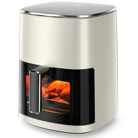 Modern air fryer with glass door showing interior on a white background
