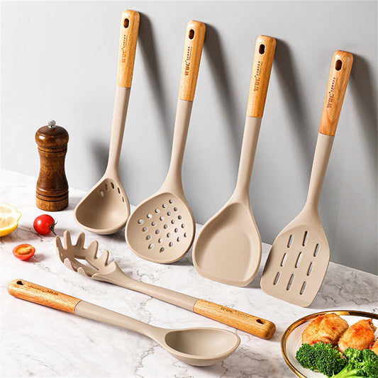 EcoNest Kitchen 4-Piece Silicone Spatula Set with Wooden Handles displayed on a countertop, showcasing their versatility.