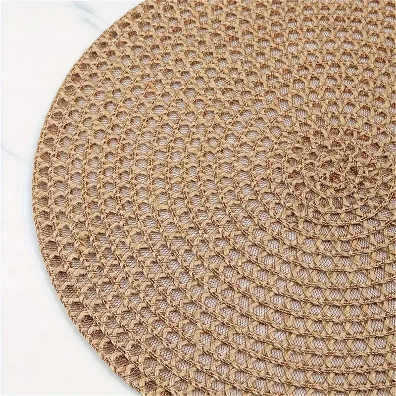 Round woven mat with a textured pattern on a white background