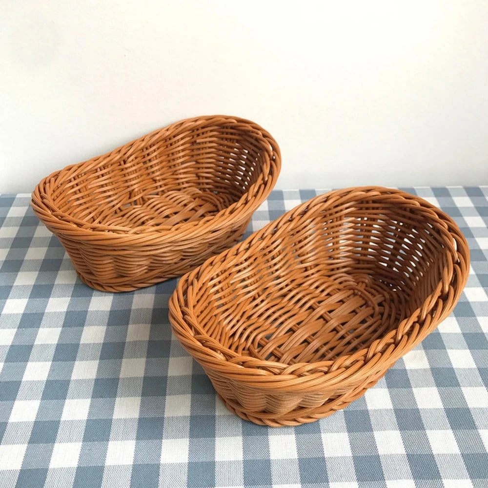 Two wicker bread baskets on a checkered tablecloth