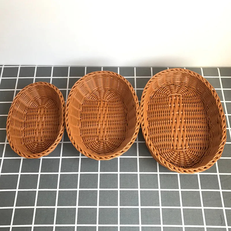 Three woven baskets of different sizes on a grid background