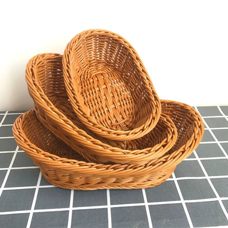 Set of three woven baskets on a checkered surface