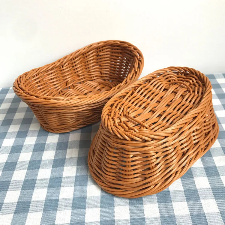 Two wicker bread baskets on a checkered tablecloth