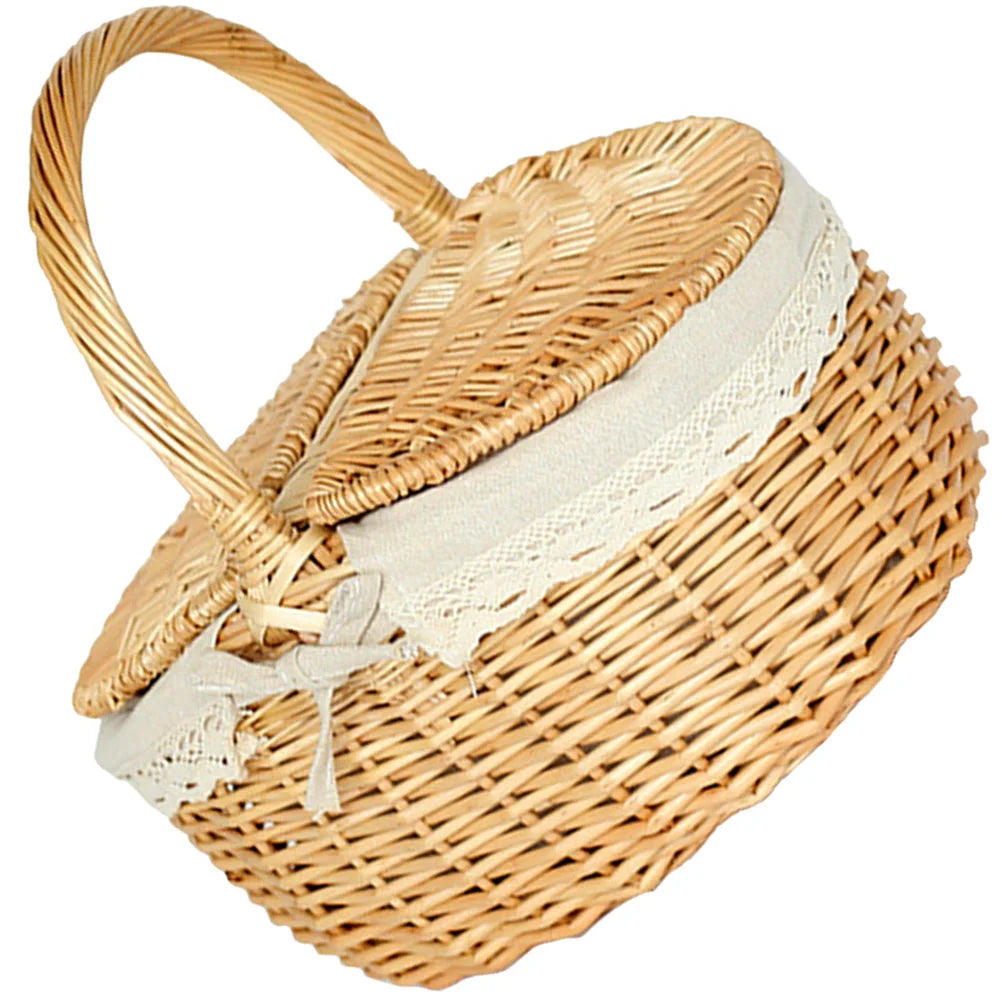 Wicker picnic basket with a white lining on a white background