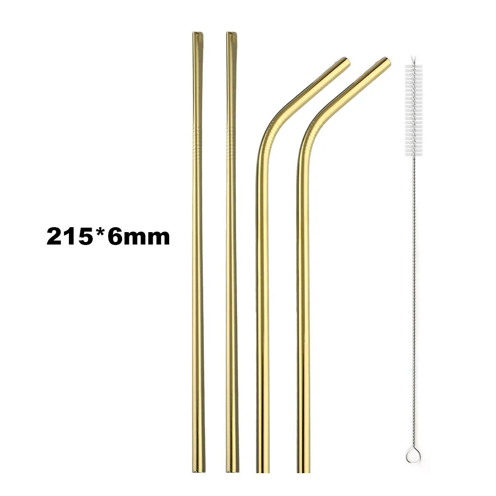 Set of gold metal straws and cleaning brush on a white background