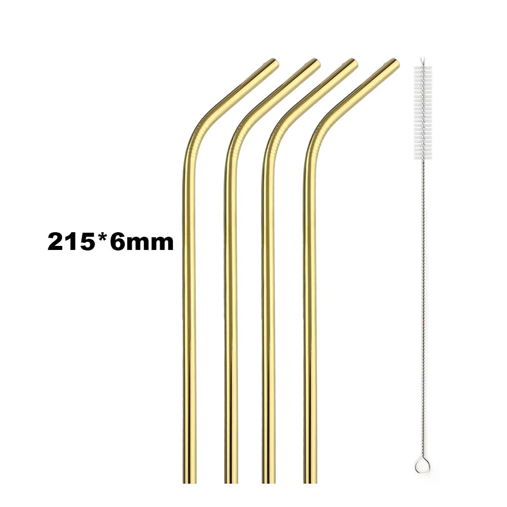 Set of gold metal straws with a cleaning brush on a white background