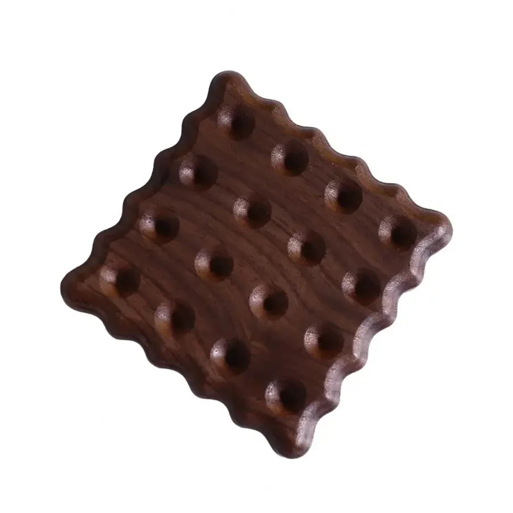 Wooden puzzle piece with holes on a white background