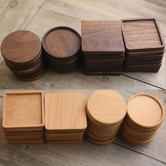 Stacks of wooden coasters on a wooden surface