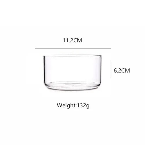 Clear glass bowl with measurements on a white background