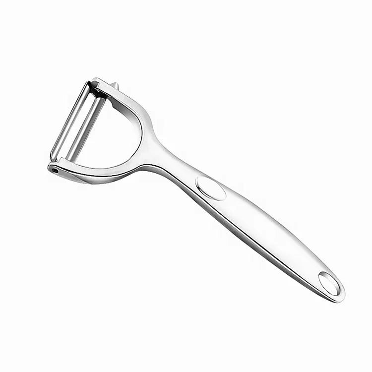 Metallic kitchen peeler on a white background