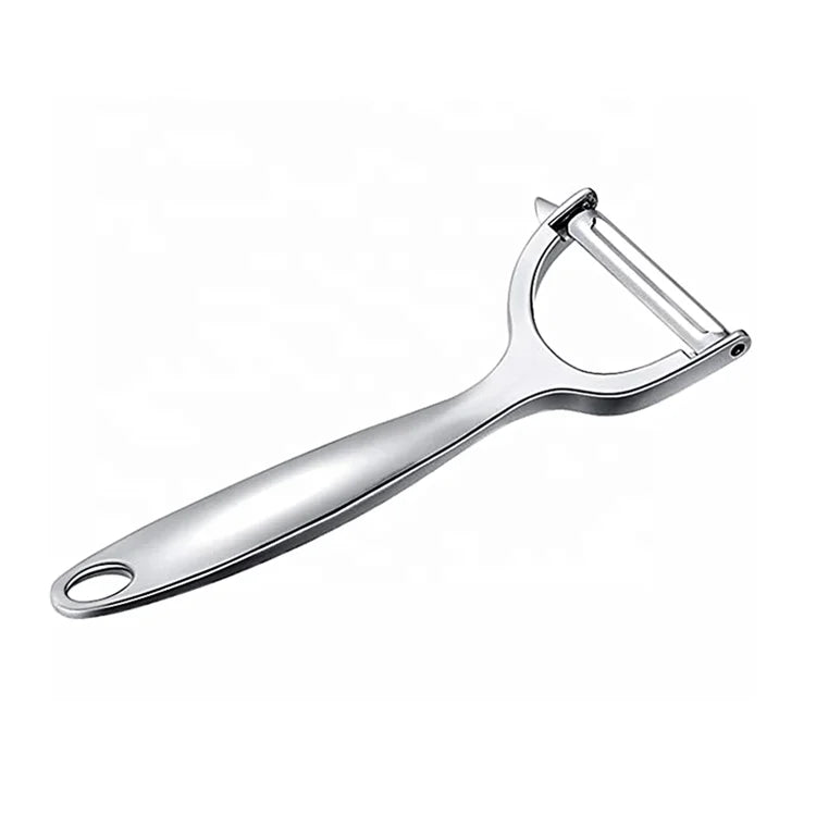 Metallic kitchen peeler on a white background