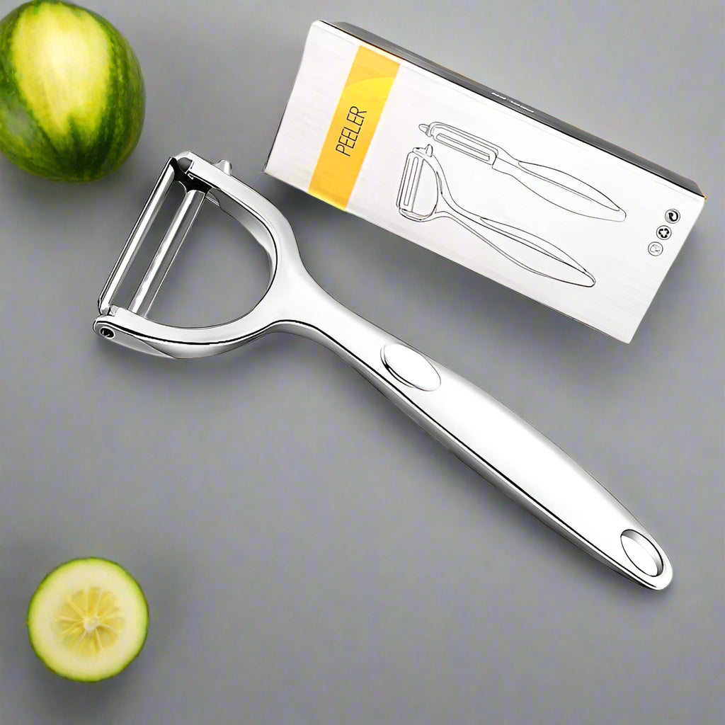 Metal peeler with packaging on a white background
