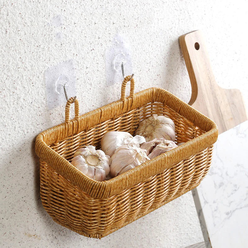 Woven basket with garlic on a textured wall