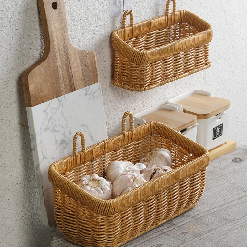 Wicker baskets and a wooden cutting board against a light-colored wall.