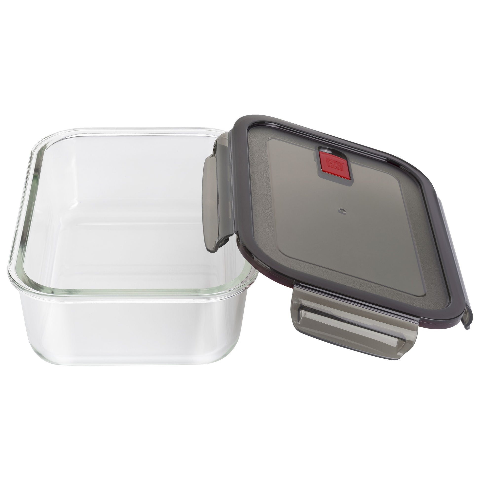 Glass food storage container with a black lid on a white background