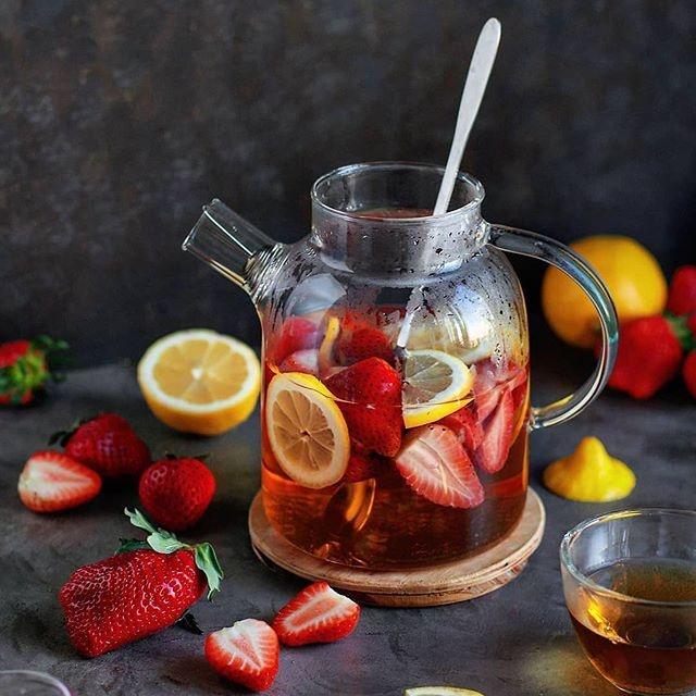Thermo Glass Teapot 54 Fl Oz | High temperature and shock resistant filled with strawberries and lemons, eco-friendly kitchenware.