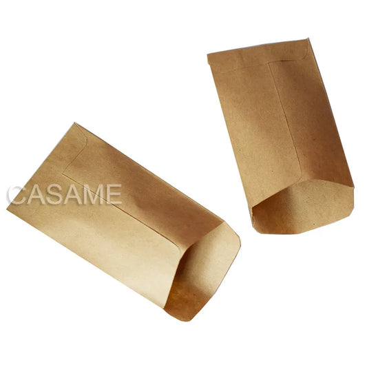 Two brown paper bags on a white background with 'CASAME' branding.