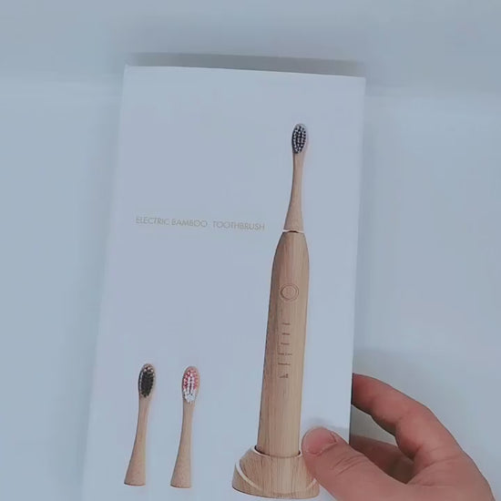 Biodegradable bamboo electric toothbrush with soft bristles and waterproof design for eco-friendly oral care