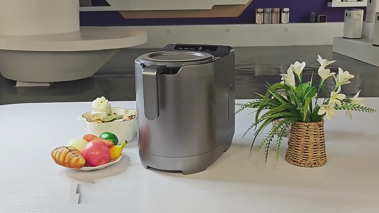 Envitek Recycle Food Machine in a modern kitchen setting, showcasing its sleek black design and stainless steel grinding chamber for effective food waste composting.