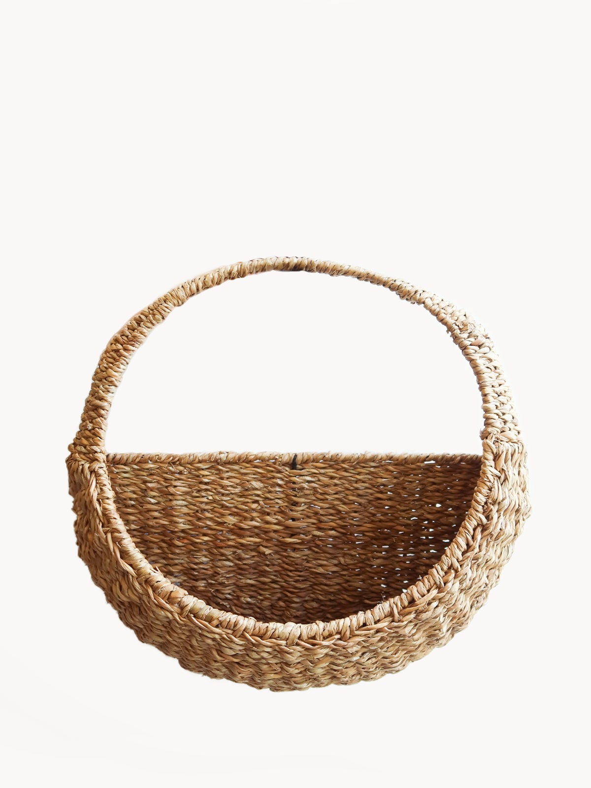 Savar handmade woven wall hanging basket made from natural seagrass - front view showing round shape and handle