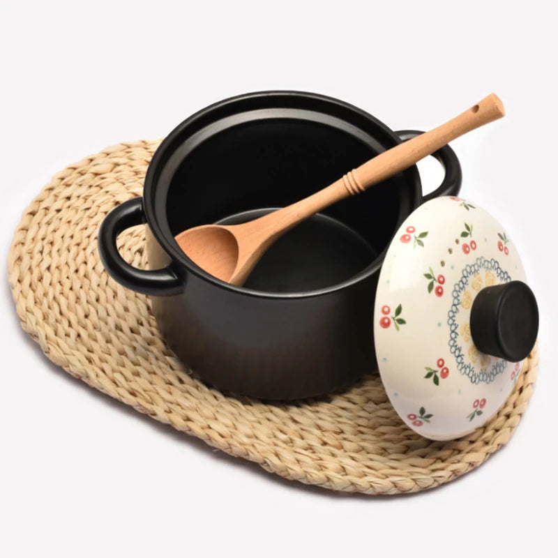 Natural wood kitchen utensils set including spatula and spoon for eco-friendly, non-stick cooking.