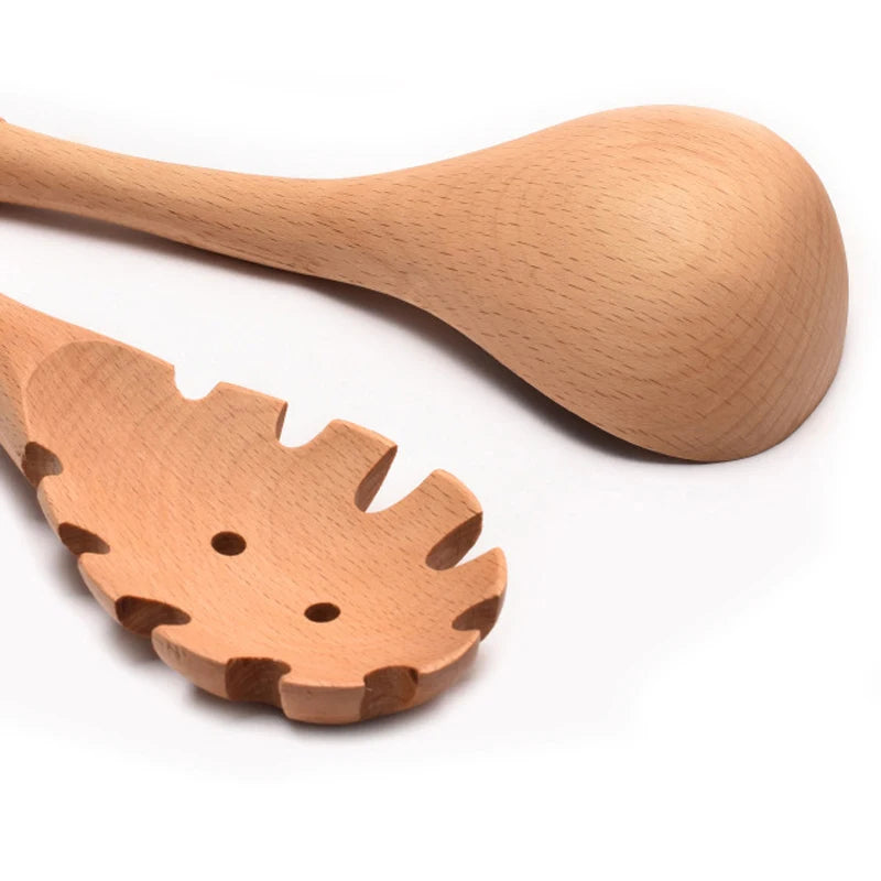 Natural wood kitchen utensils set including spatula and spoon for eco-friendly, non-stick cooking.