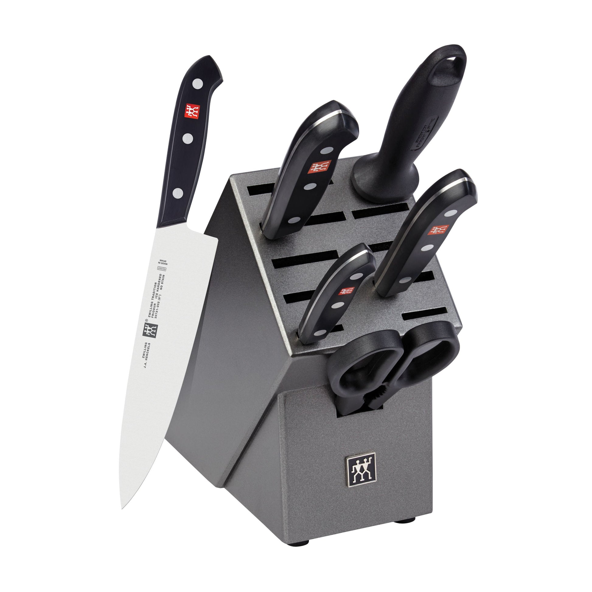 Knife set with black handles in a gray block on a white background